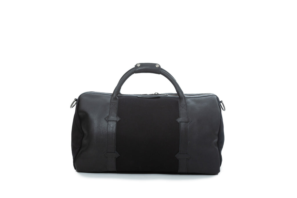 TAMARACK leather duffle bag by Mezquite Leather  handcrafted travel bag inspired by the tamarack tree, symbol of endurance and heritage.