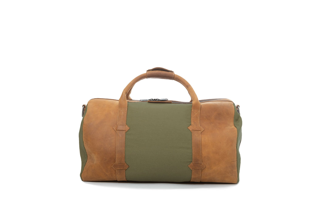 TAMARACK leather duffle bag by Mezquite Leather handcrafted travel bag inspired by the tamarack tree, symbol of endurance and heritage.