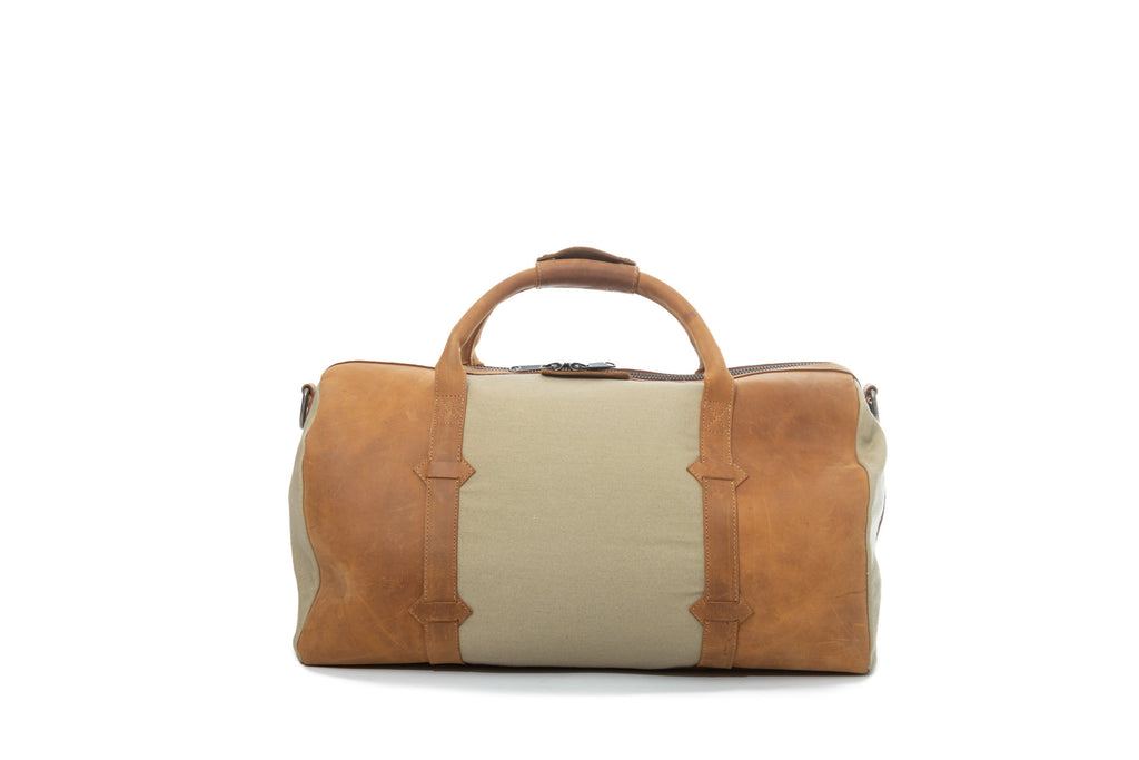 TAMARACK leather duffle bag by Mezquite Leather handcrafted travel bag inspired by the tamarack tree, symbol of endurance and heritage.