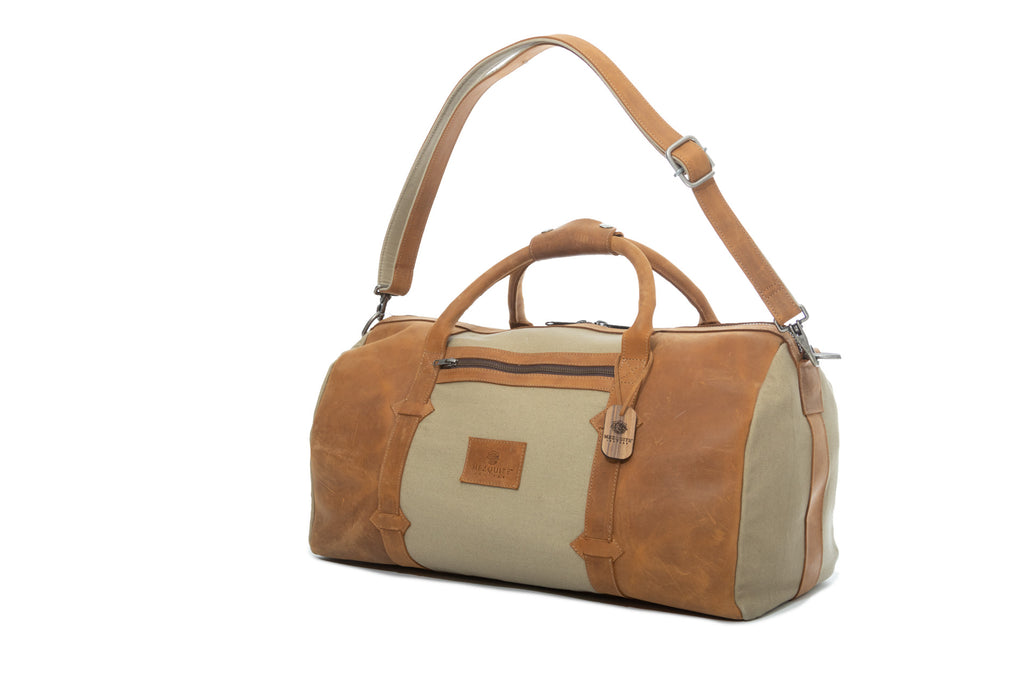 TAMARACK leather duffle bag by Mezquite Leather  handcrafted travel bag inspired by the tamarack tree, symbol of endurance and heritage.