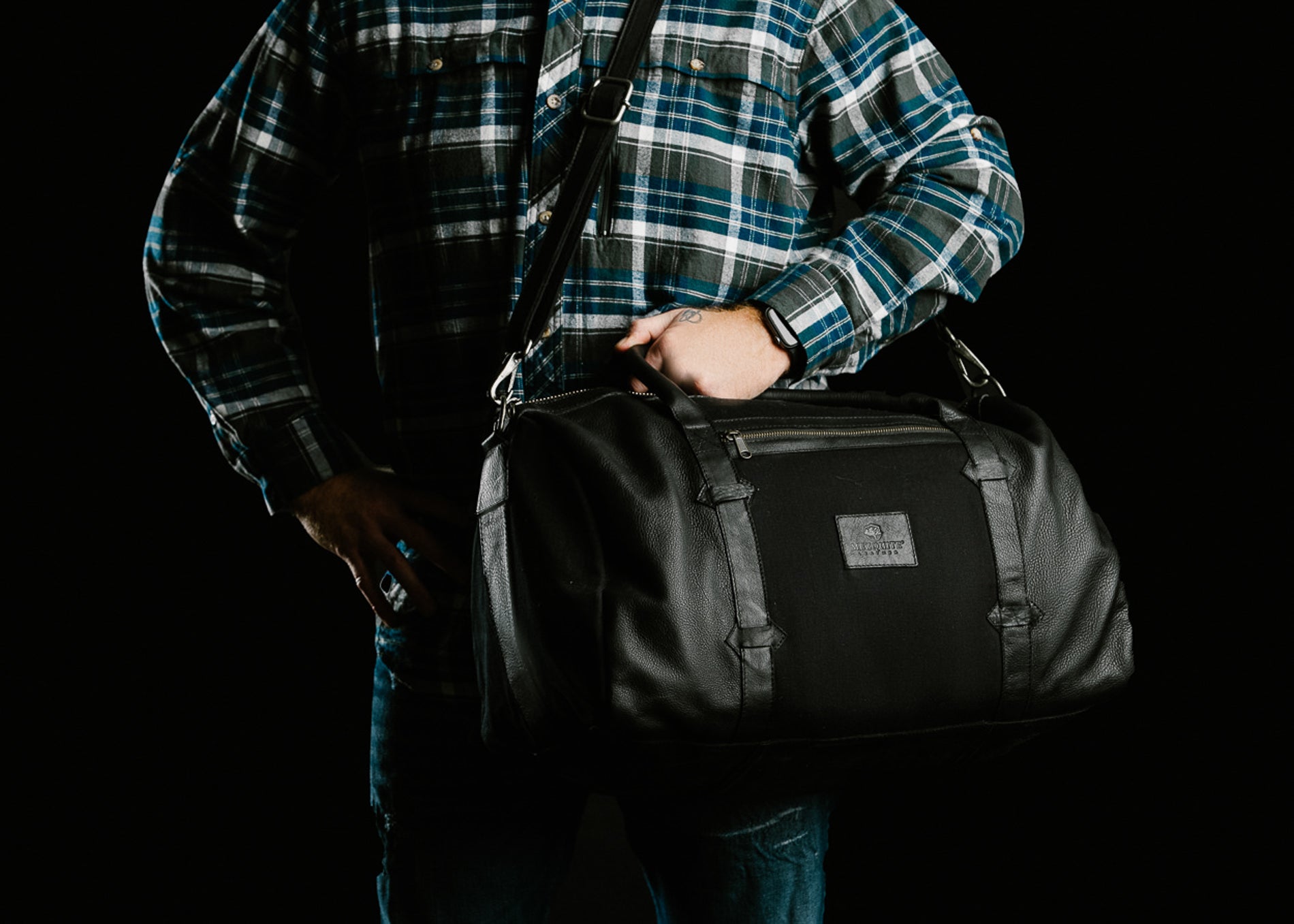 TAMARACK leather duffle bag by Mezquite Leather — handcrafted travel bag inspired by the tamarack tree, symbol of endurance and heritage.